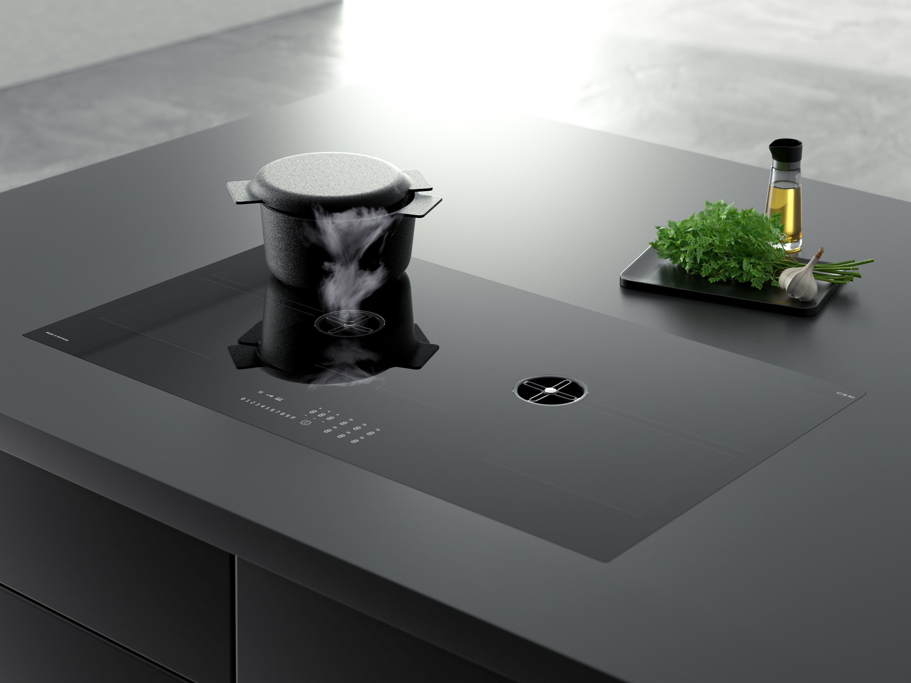 CASO Design Induktionskochfeld mit 2 kleinen runden Muldenlüfter eines davon in Betrieb